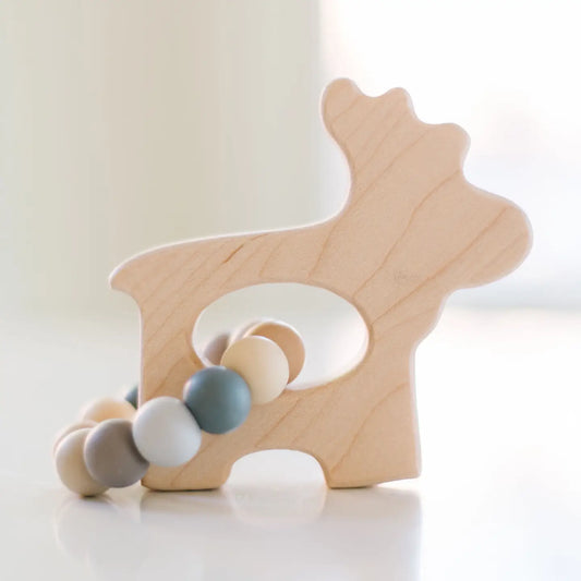moose grasping wooden baby toy with teething beads